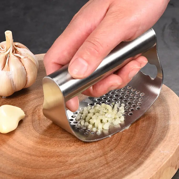 Stainless steel garlic press for kitchen use