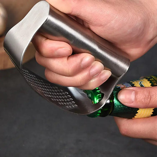 Stainless steel garlic press for kitchen use